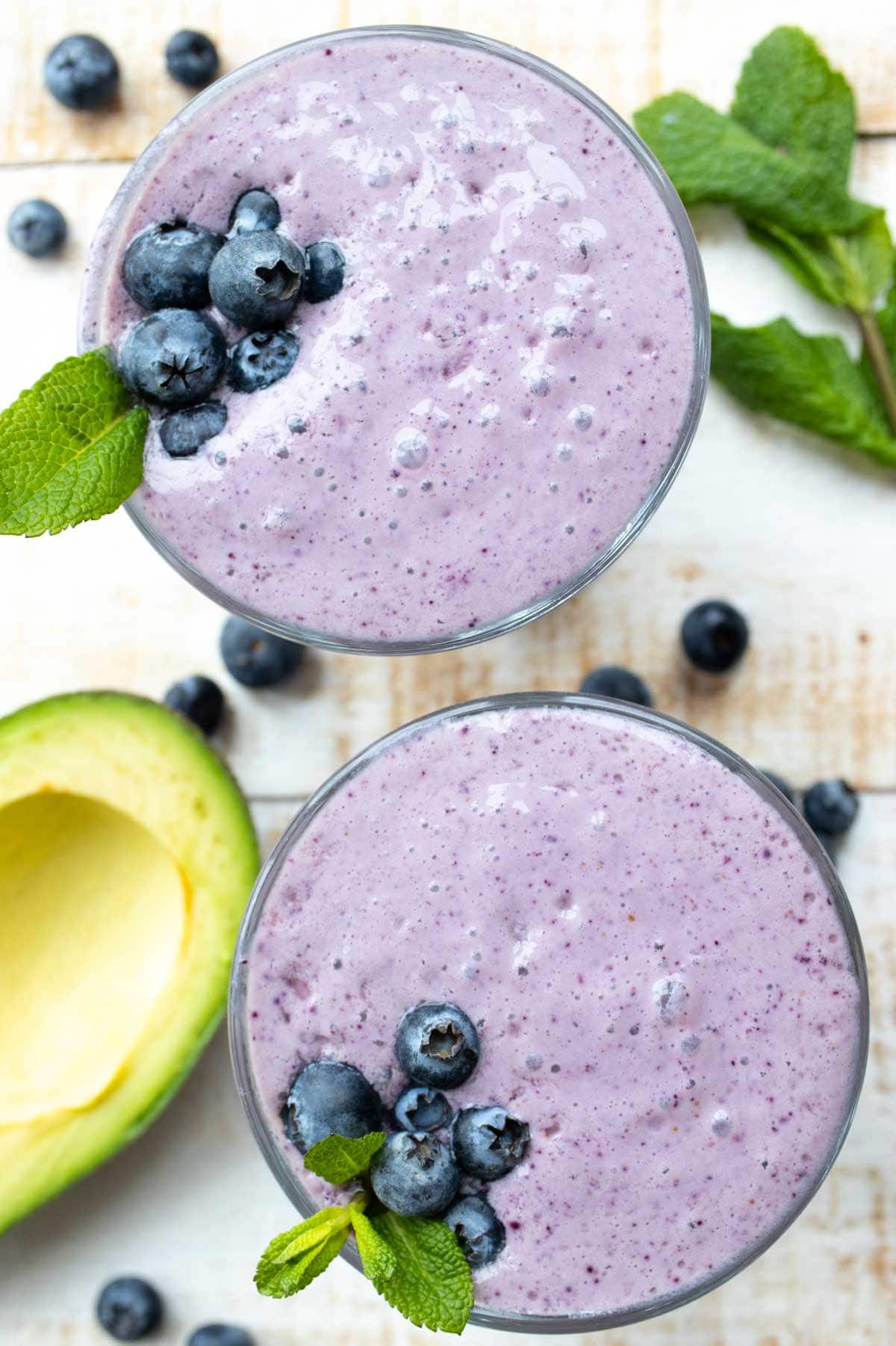 two glasses with blueberry smoothie