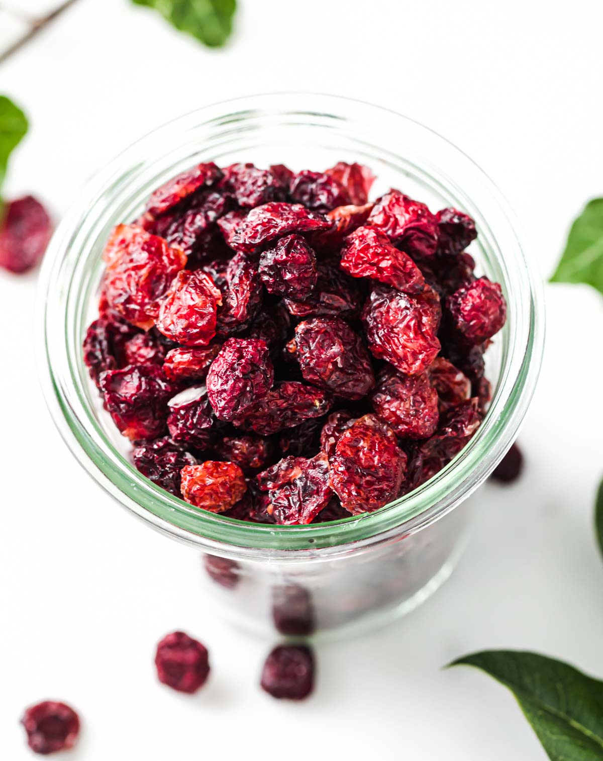 a glass jar with dried cranberries