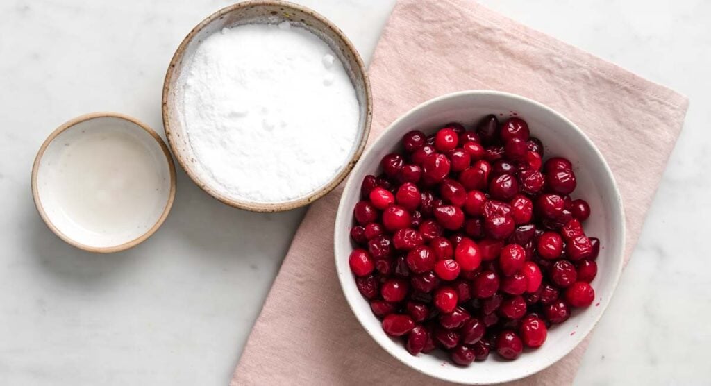 cranberries, sweetener and coconut oil in bowls