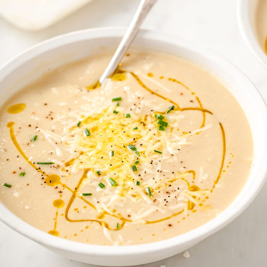 a bowl of keto cauliflower soup with a spoon
