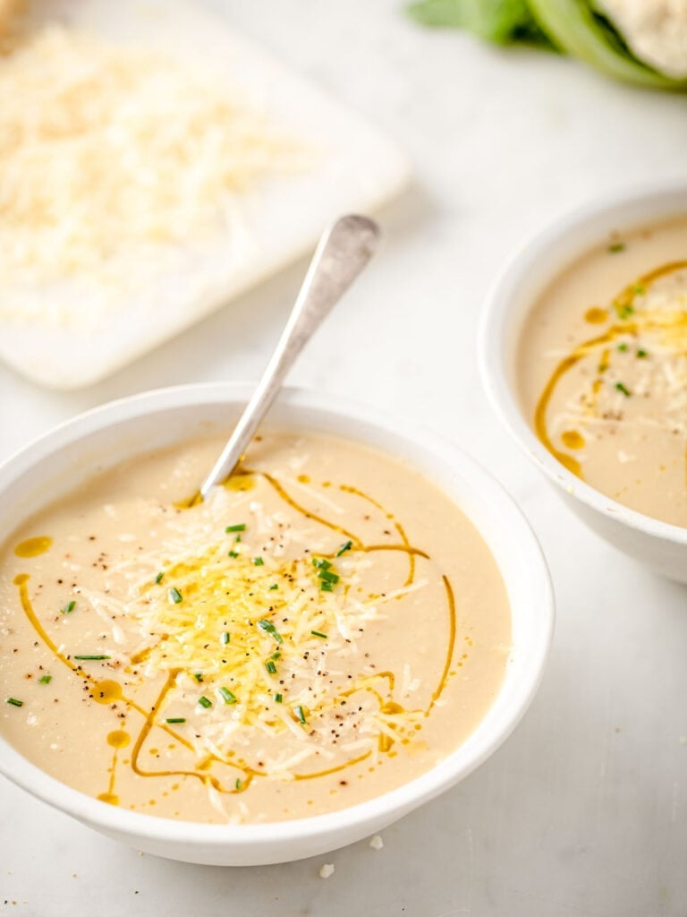 roasted cauliflower soup in bowls and spoon