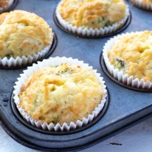 keto cheese muffins in paper cases in a muffin pan