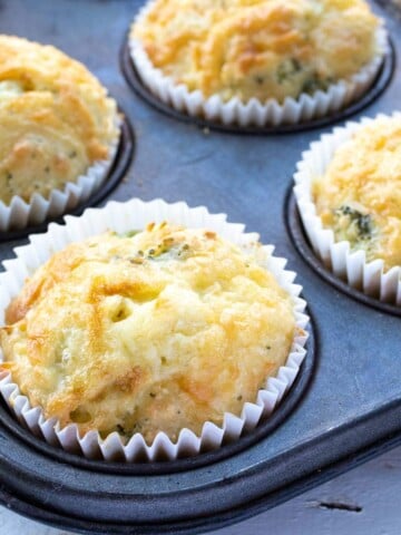 keto cheese muffins in paper cases in a muffin pan