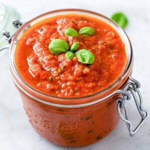 a mason jar with keto pizza sauce