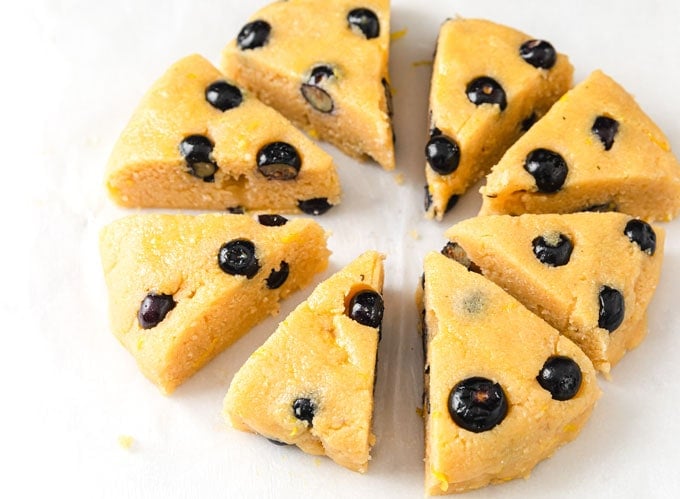 unbaked blueberry scone triangles on baking paper