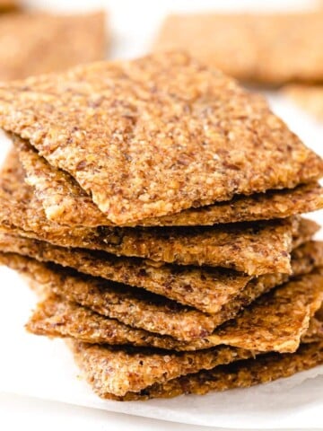 flaxseed crackers piled on top of each other into a stack