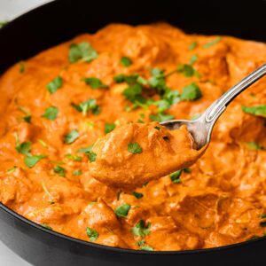 keto chicken tikka masala in a pan and a spoon