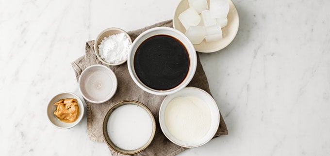 ingredients for a dairy free coffee smoothie measured into bowls