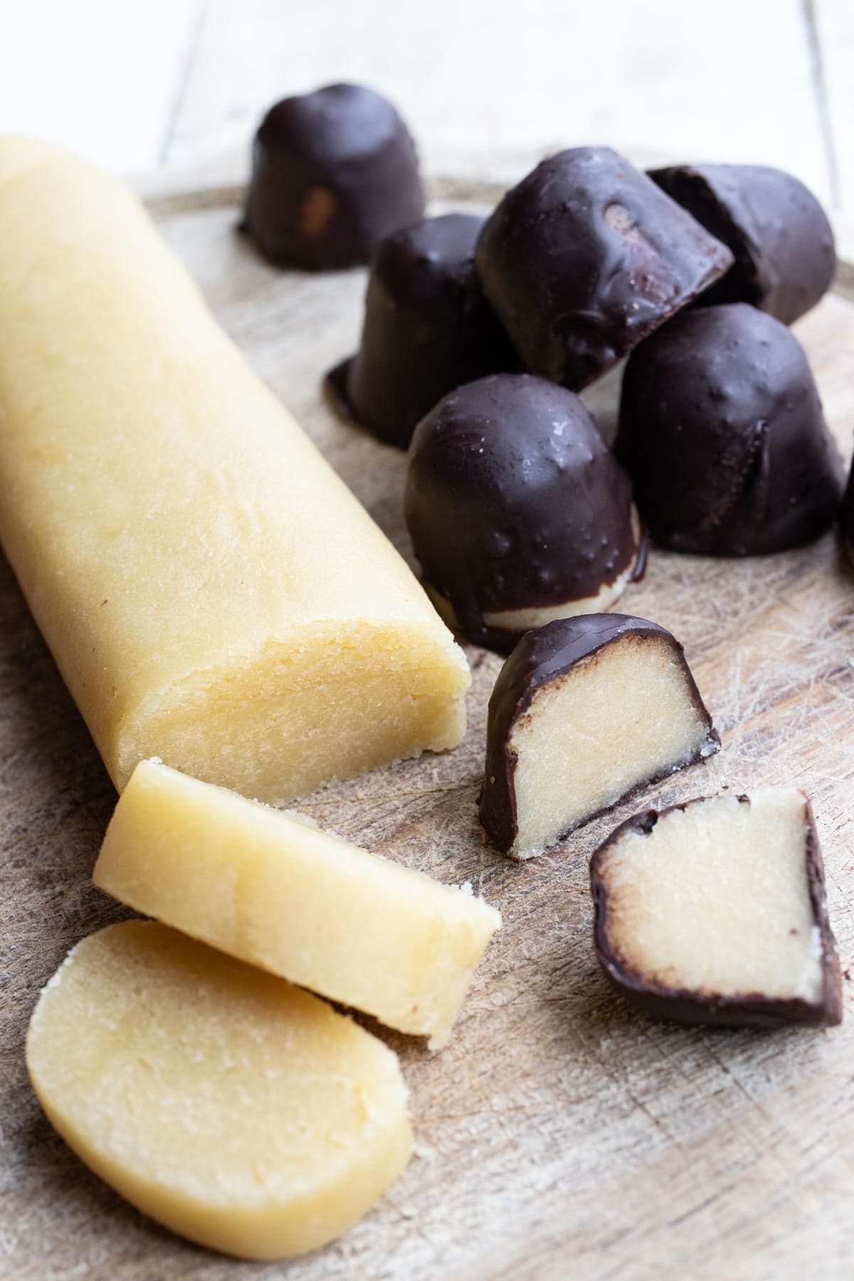 a log of sugar free marzipan and chocolate covered marzipan pralines