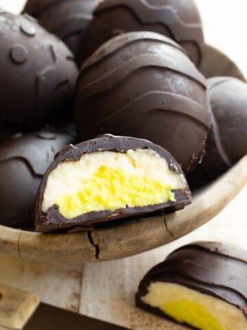sugar free easter eggs made with chocolate and a mascarpone filling, one is sliced open showing the inside