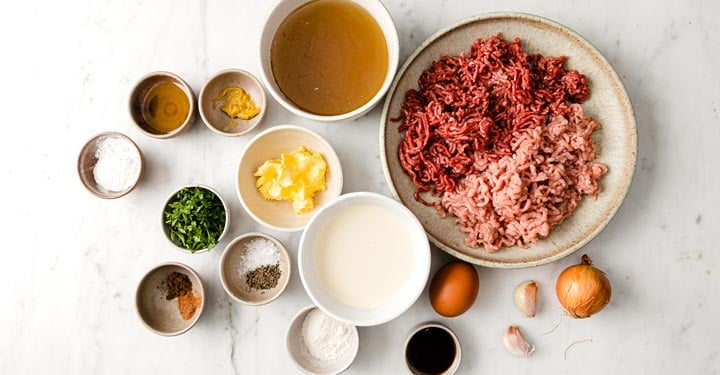 ingredients for swedish meatballs measured into bowls