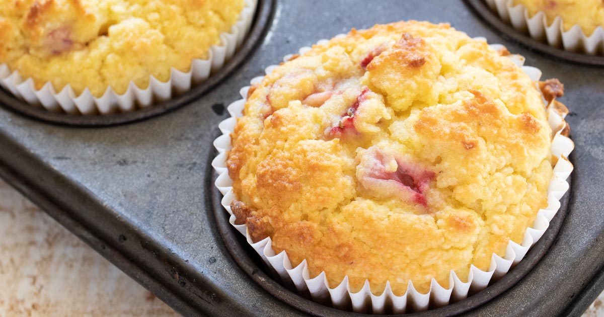 a keto strawberry muffin in a muffin pan