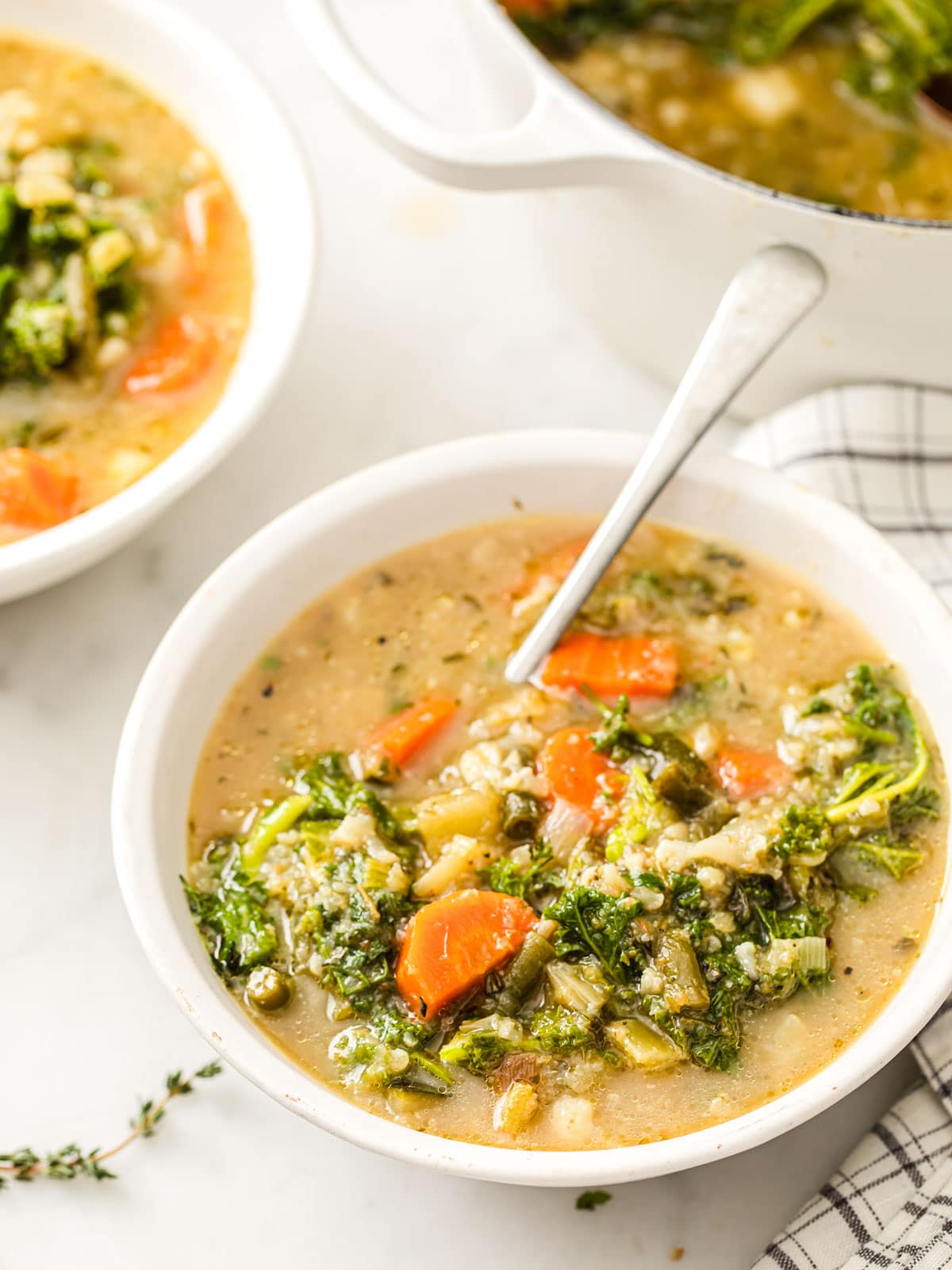 a bowl of low carb vegetable soup and a spoon
