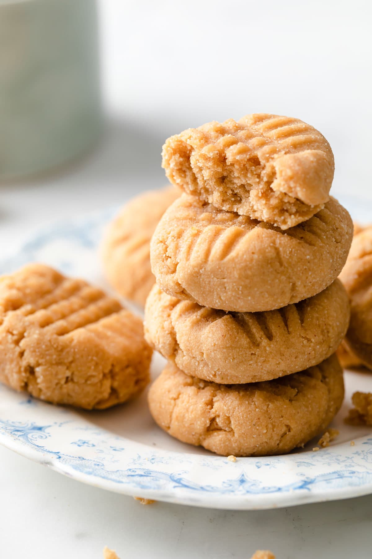 a stack of thick soft cookies with fork indentations on top