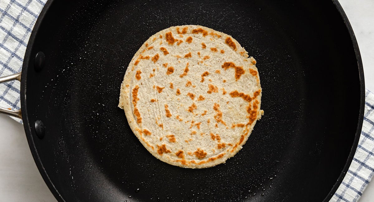 a fried tortilla in a frying pan