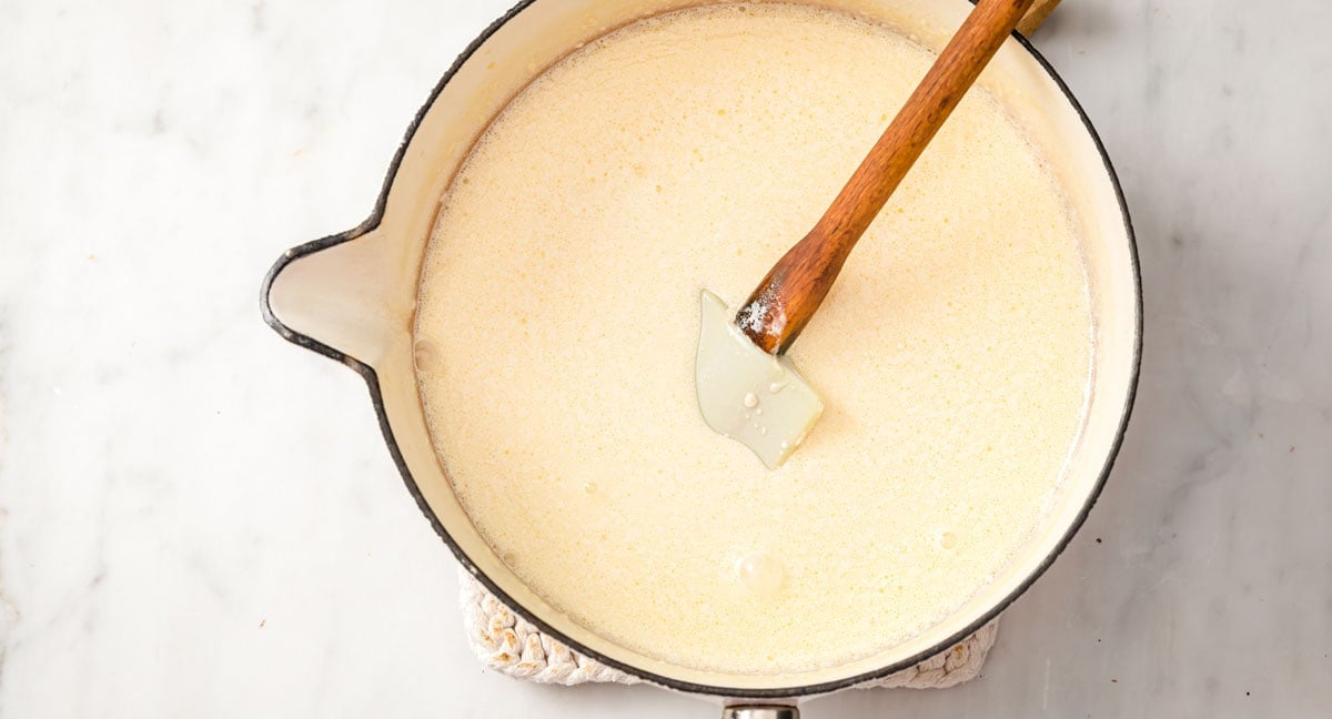 cream, oil and almond milk in a saucepan with a spatula