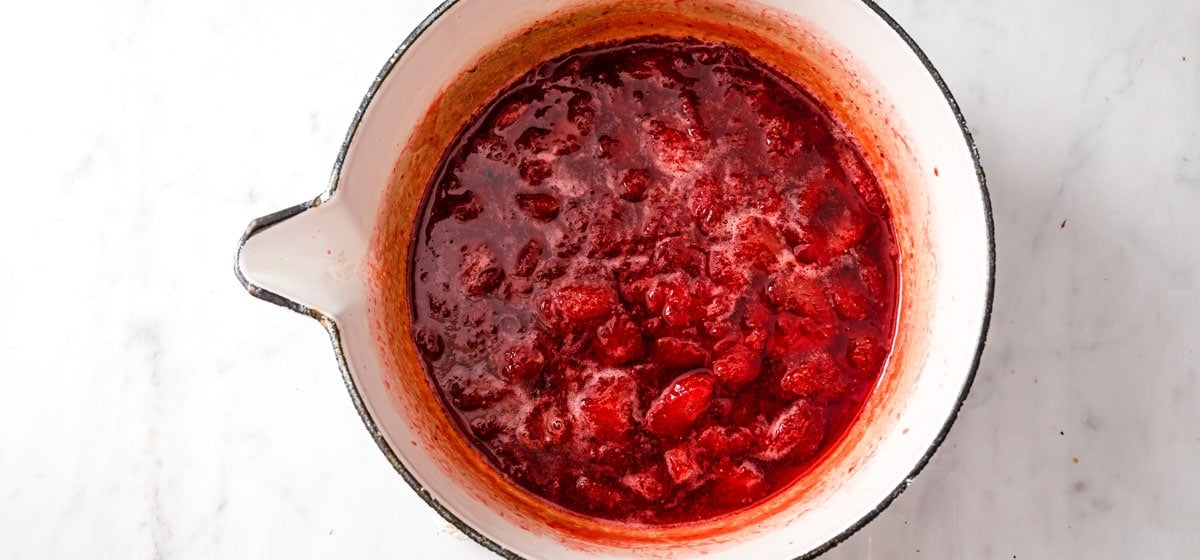 cooking strawberries in a saucepan