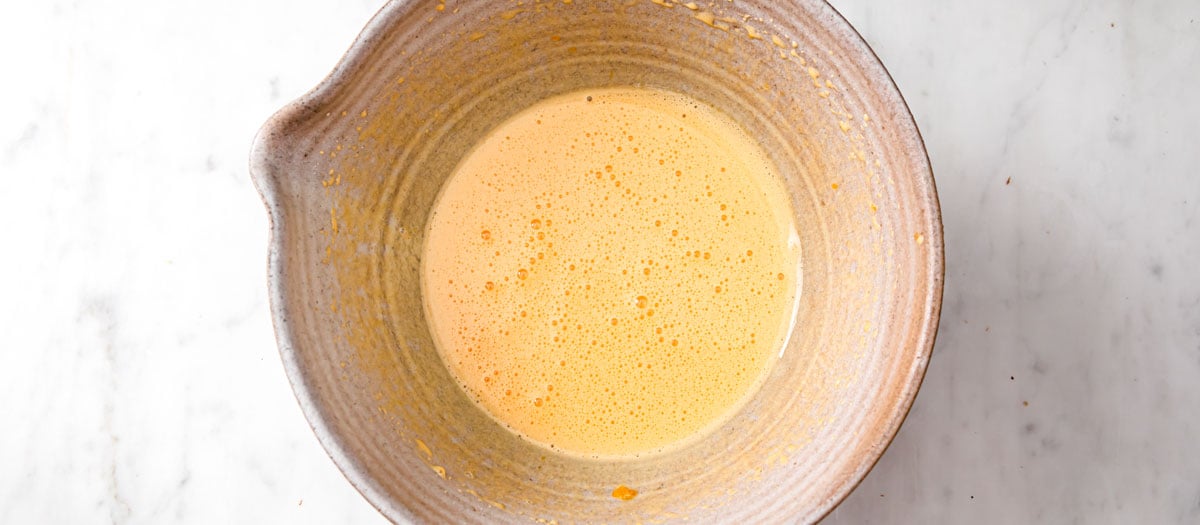 beaten egg yolks in a bowl