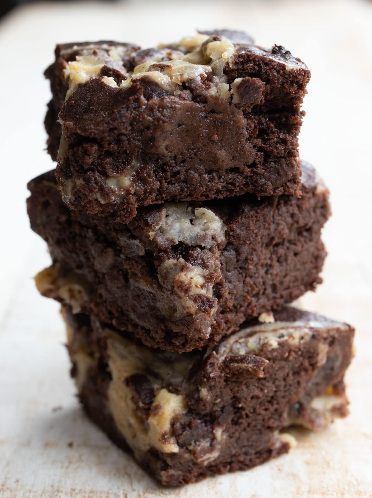 stack of three brownies with a caramel swirl