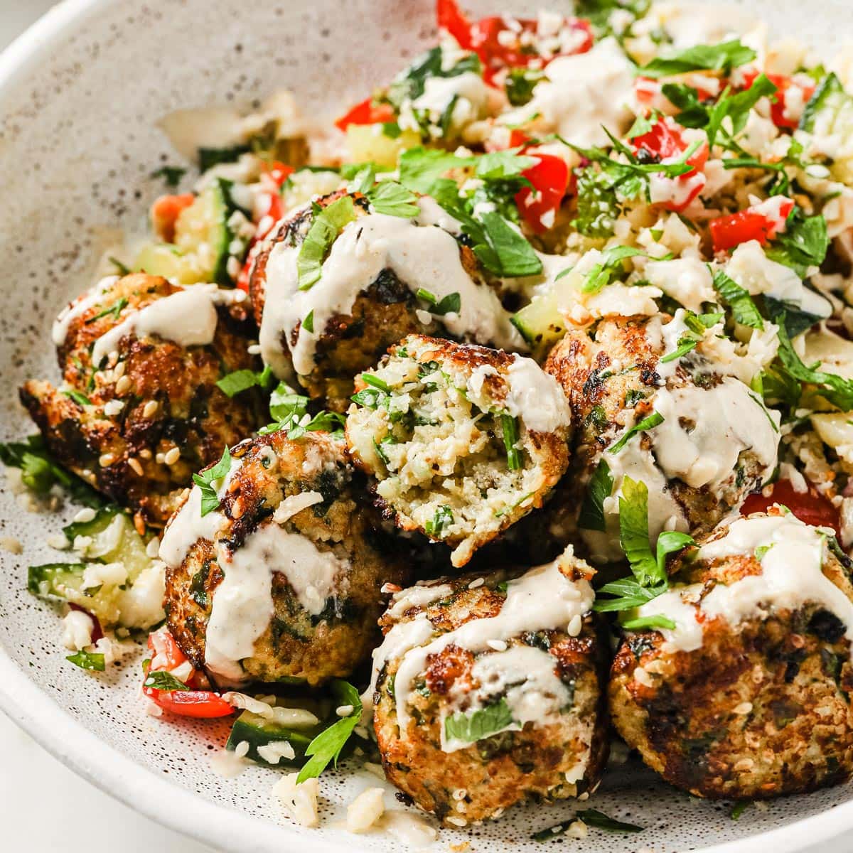 a plate with keto falafel and cauliflower tabbouleh