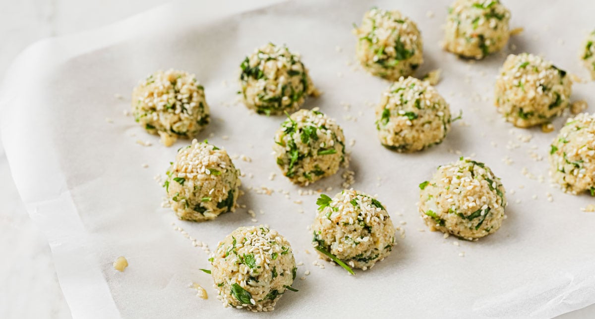 cauliflower falafel before baking on a baking sheet lined with parchment