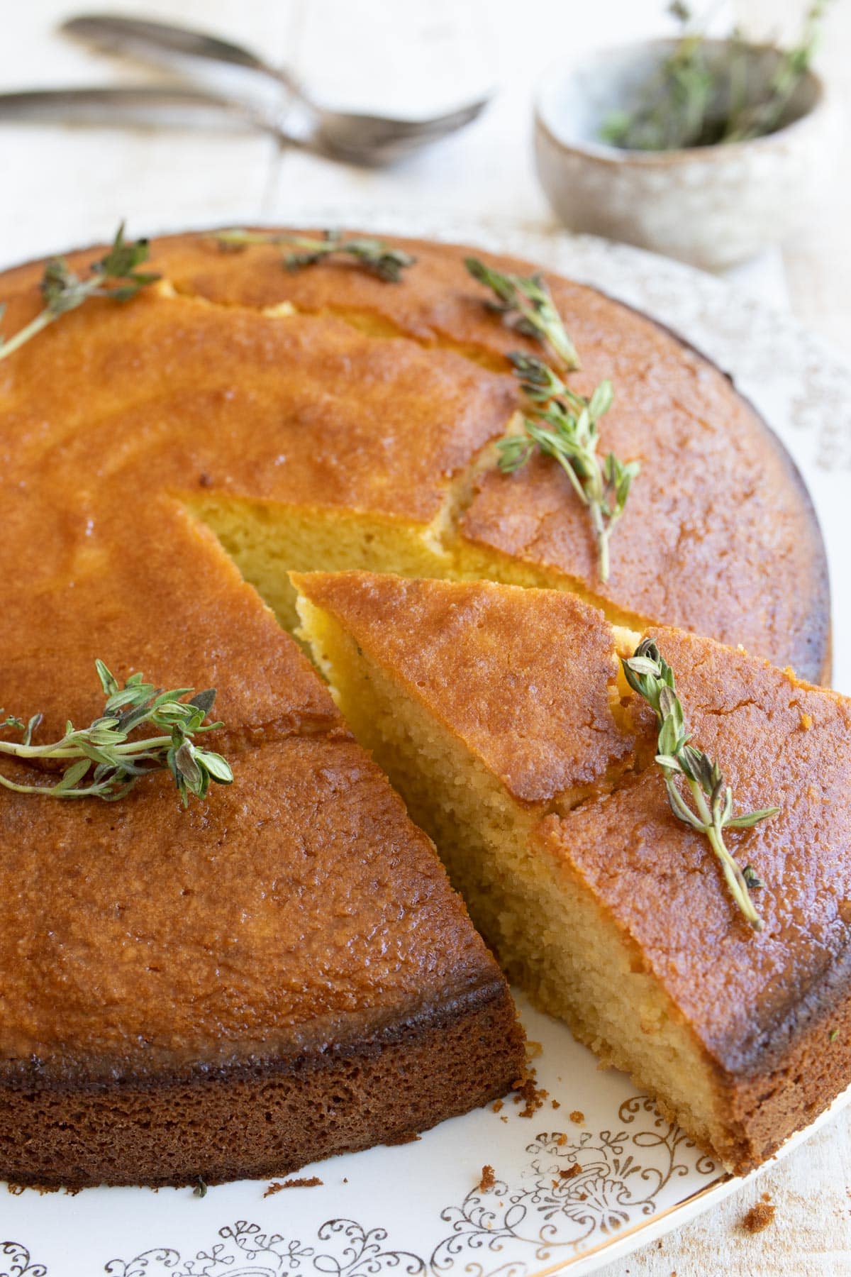 a keto olive oil cake topped with lemon thyme