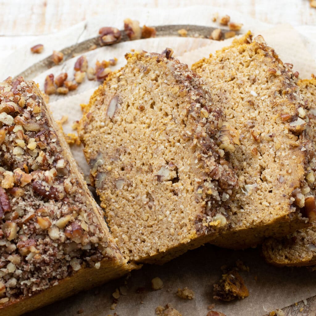 slices of keto pumpkin bread with a pecan nut crust