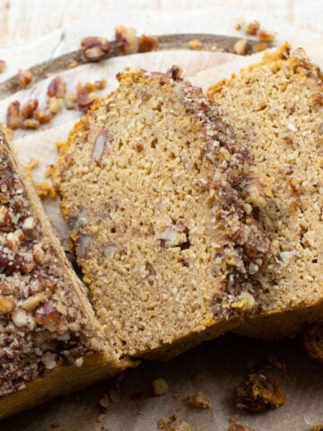 slices of keto pumpkin bread with a pecan nut crust