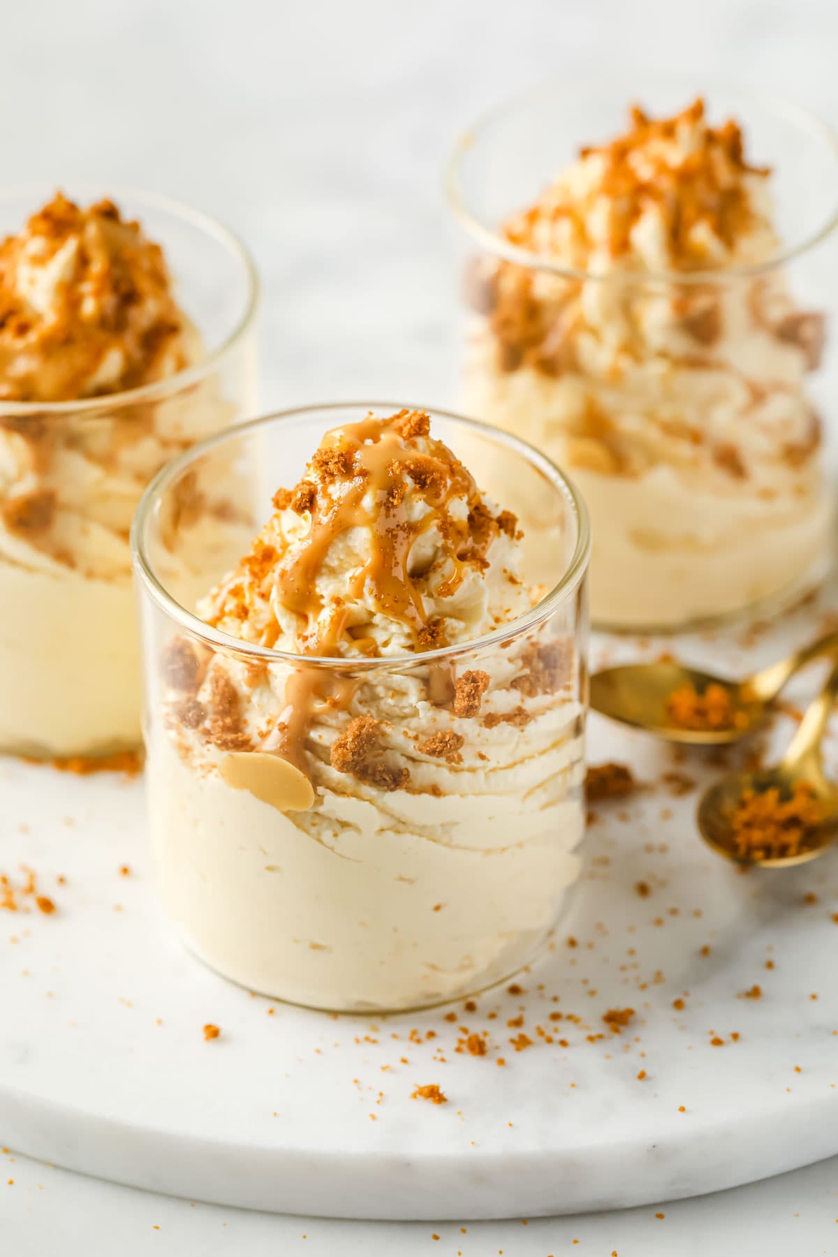 3 dessert cups with peanut butter mousse and spoons