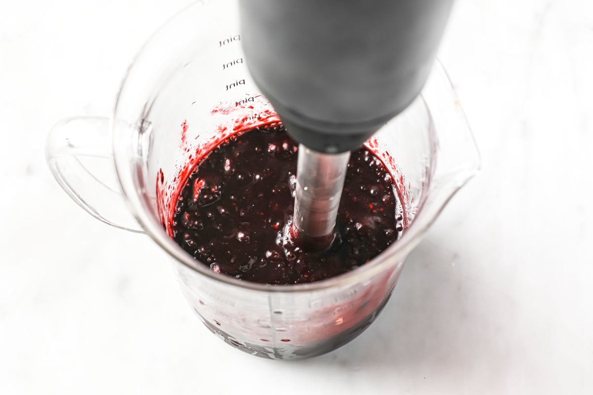 blending blackberries with a stick blender