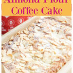 An almond flour cake topped with sliced almonds.
