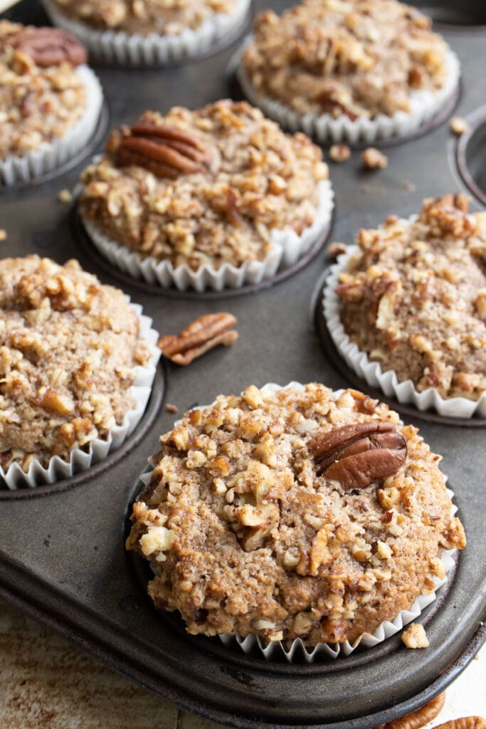 keto cinnamon muffins topped with pecans
