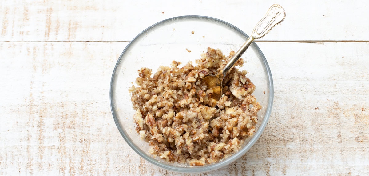 pecan streusel in a bowl with a spoon