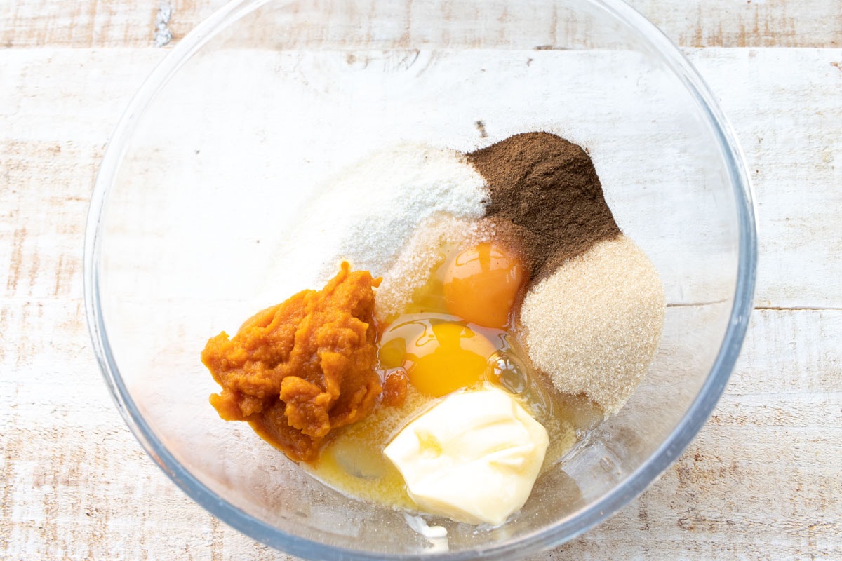 eggs, pumpkin puree and other ingredients in a bowl