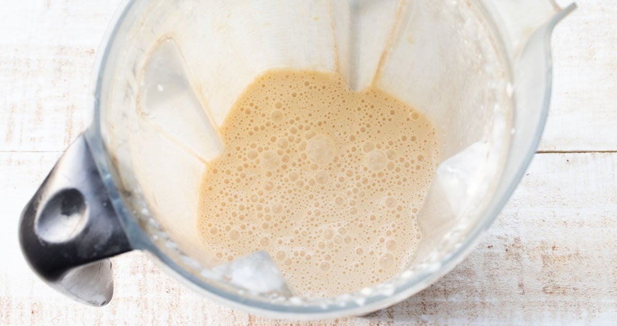 whisked eggs and wet ingredients in a blender jug