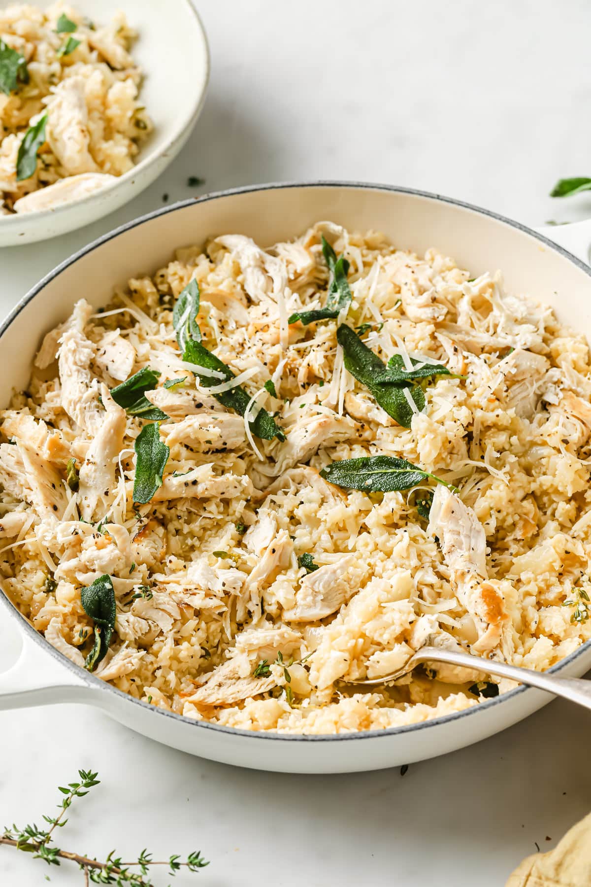 a pan with keto risotto with chicken and sage