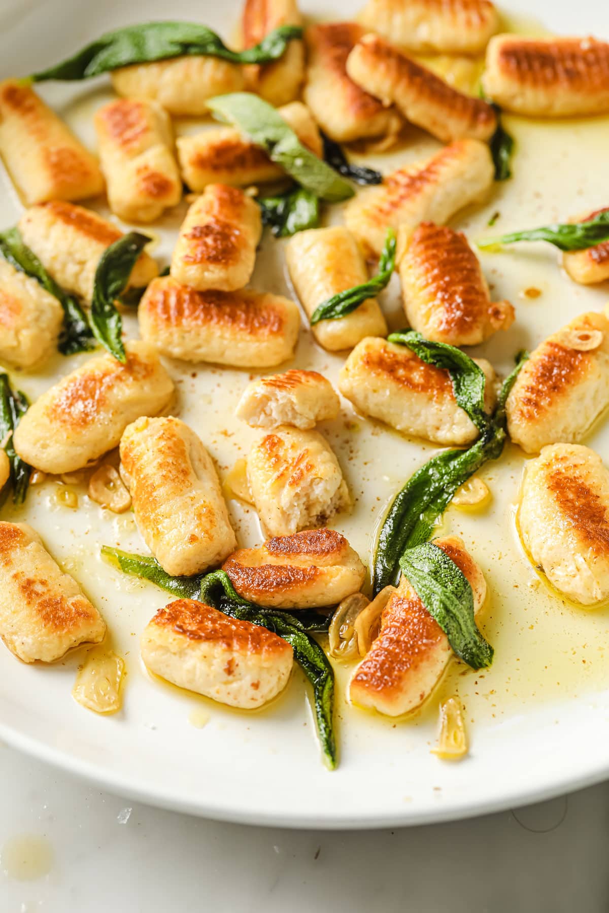 low carb gnocchi with crispy sage leaves on a plate