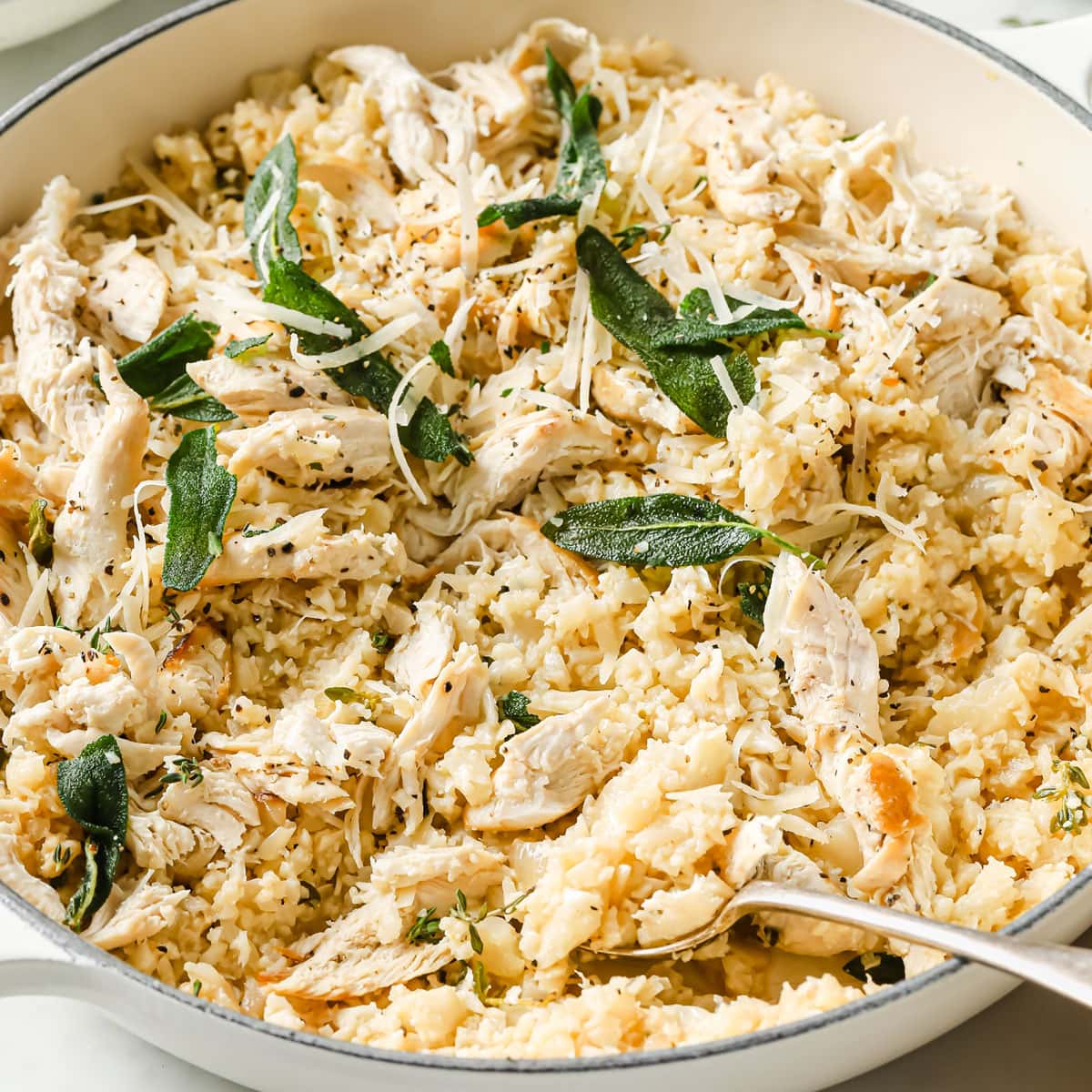 an iron cast pan with cauliflower chicken risotto