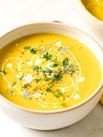 a bowl of keto butternut squash soup with cauliflower