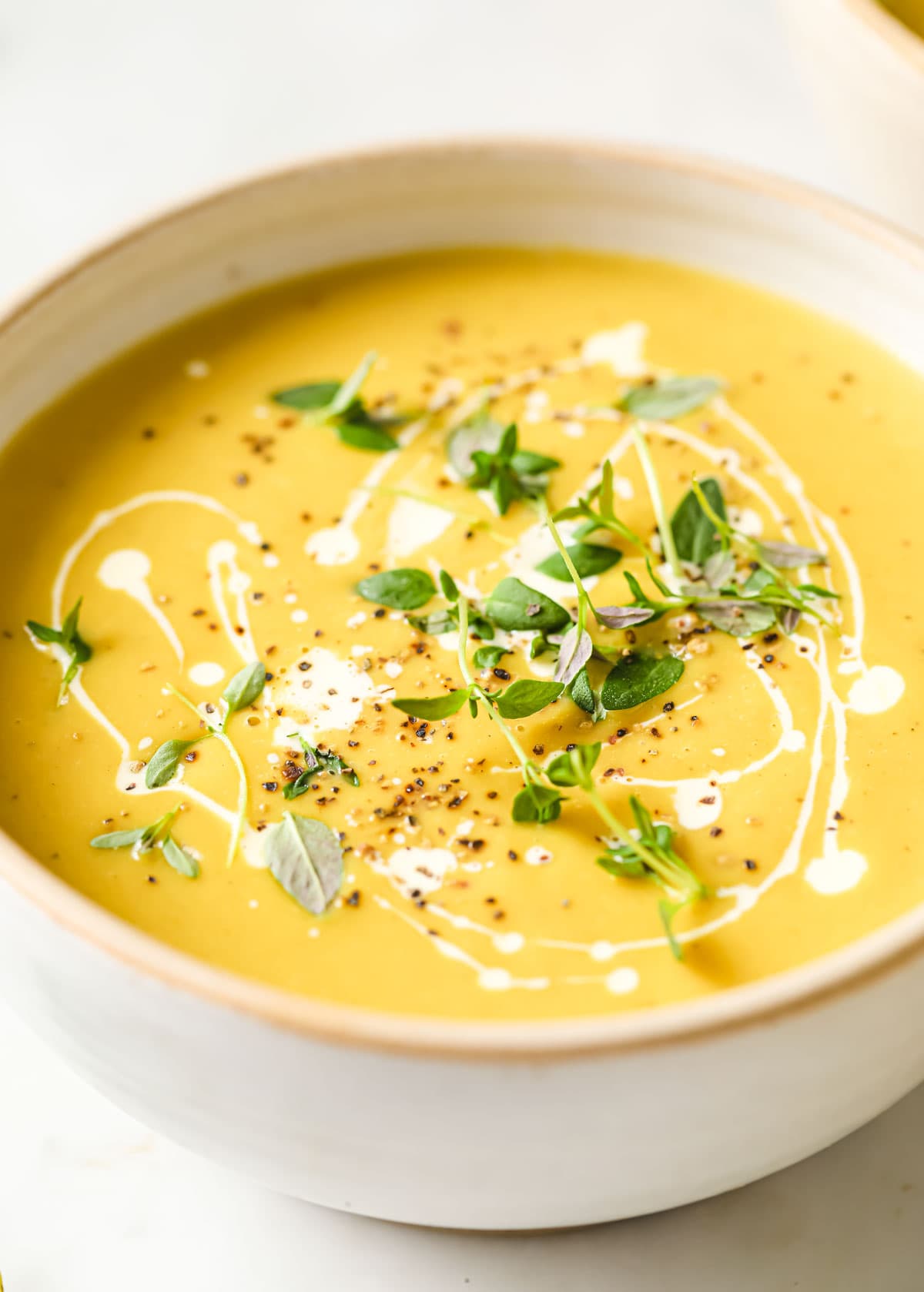butternut squash and cauliflower soup in a bowl