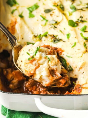 a spoonful of cottage pie with a cauliflower mash topping