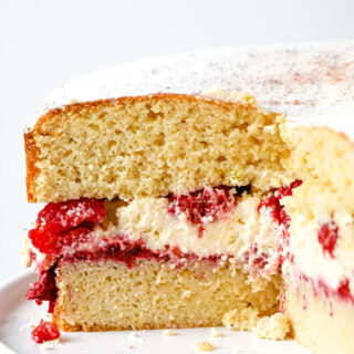 Keto Sponge Cake filled with whipped cream, fresh raspberries and raspberry chia jam