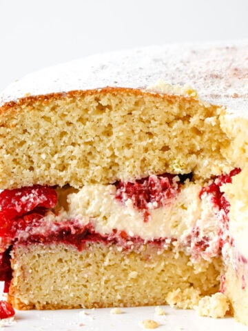 Keto Sponge Cake filled with whipped cream, fresh raspberries and raspberry chia jam