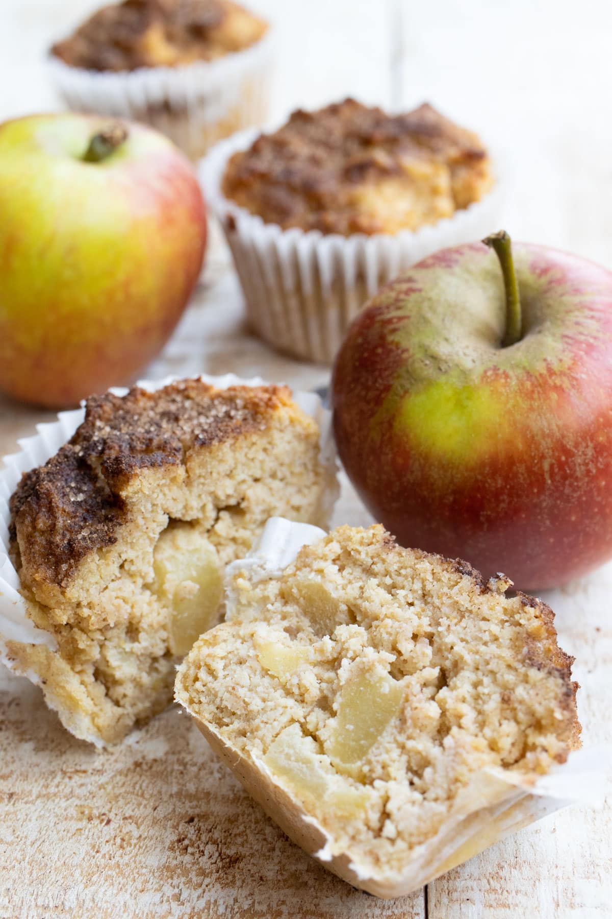 an apple muffin sliced in half showing the inside