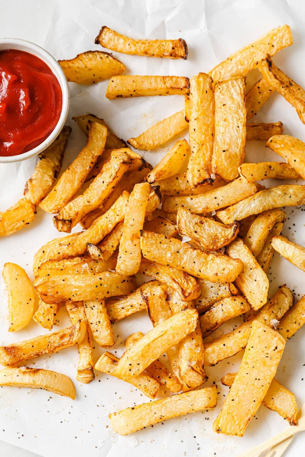 turnip fries on parchment paper
