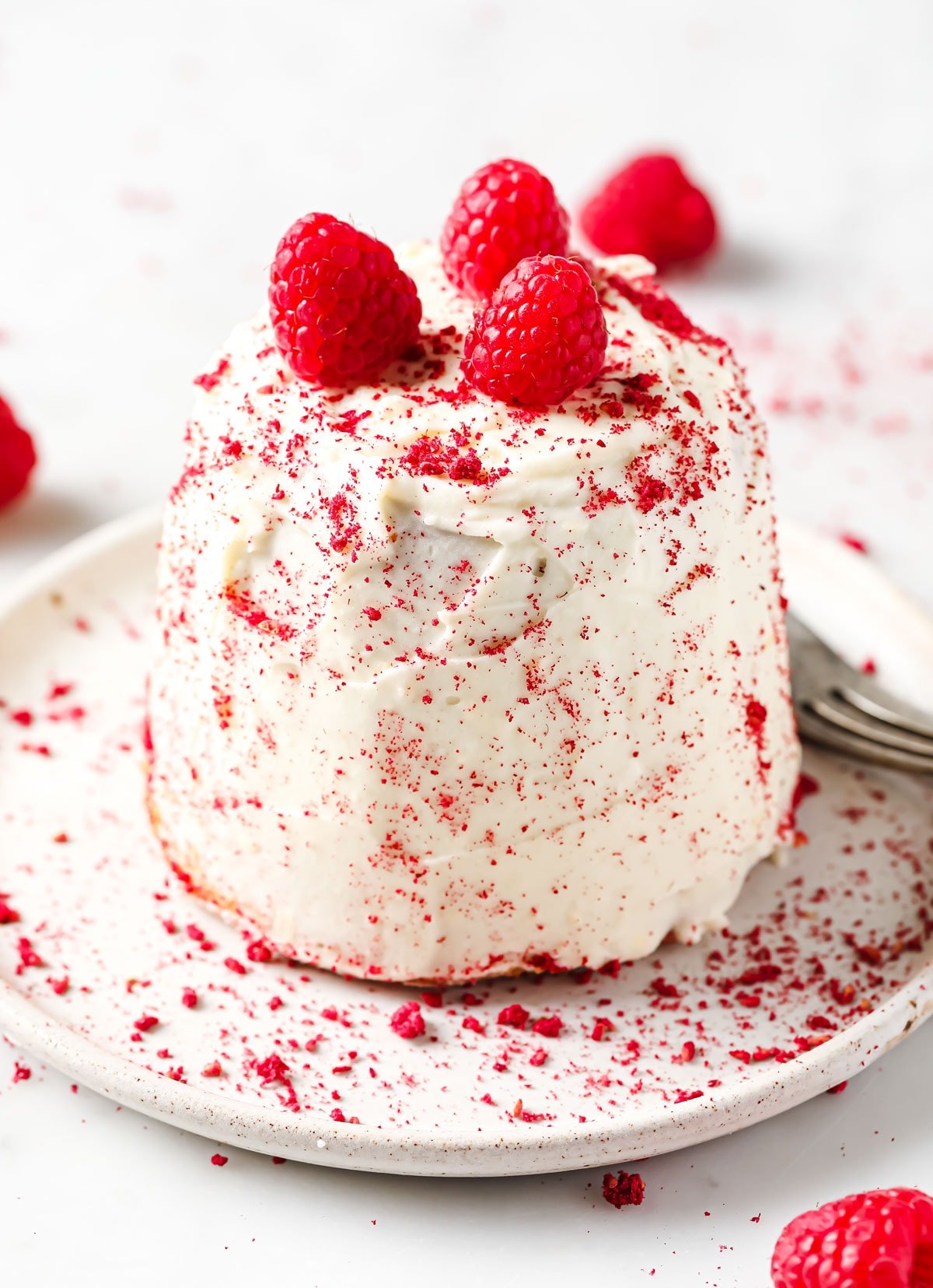 a frosted single serve raspberry cake