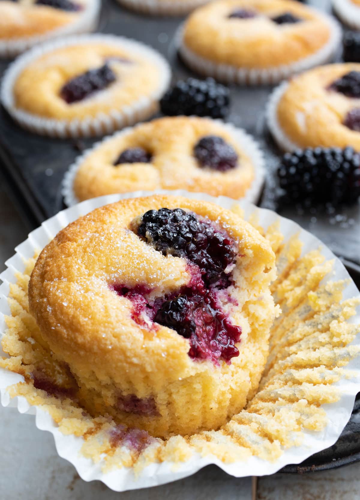 a bitten into blackberry muffin