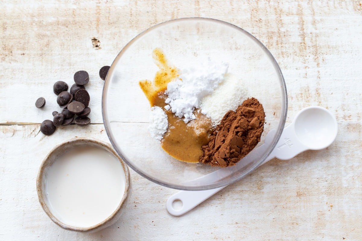 ingredients to make a mug brownie measured into a bowl