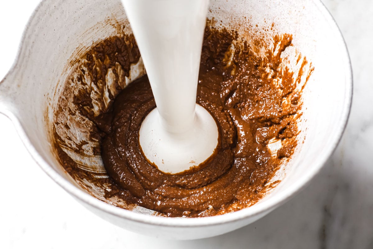 chocolate Chaffle batter in a bowl and an immersion blender