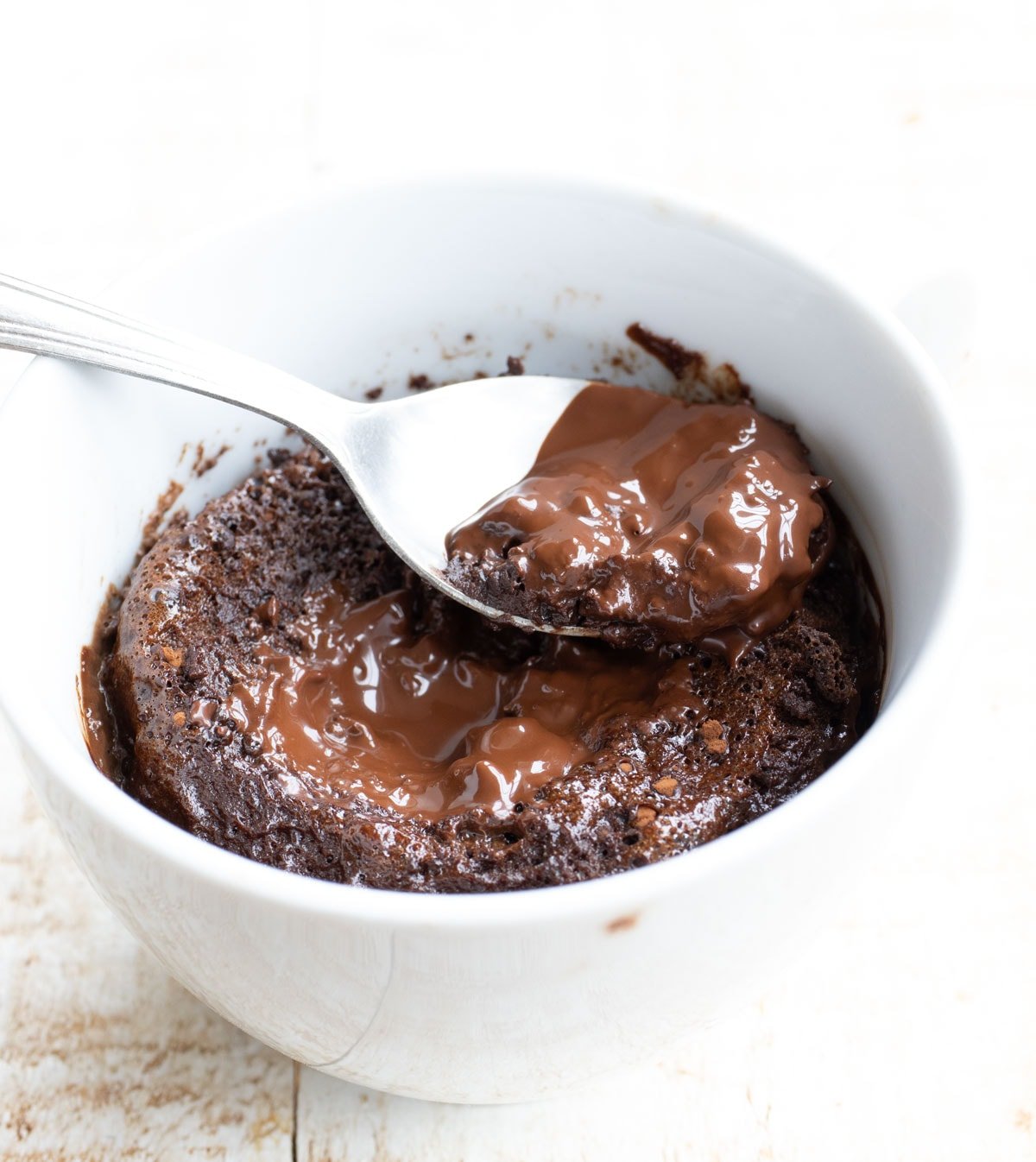 a spoon resting on a microwave lava cake